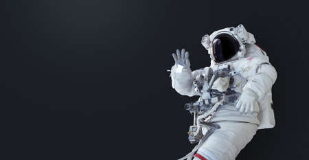 Spaceman on dark isolated background. Wallpaper with the astronaut. Space man with copyspace for text and designの写真素材