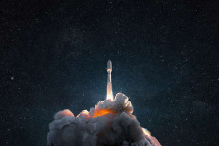 Successful launch of a rocket into space. Spaceship with smoke and blast lift off into the starry sky. Space wallpaperの写真素材