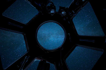 Deep starry space, view from the ISS cabin. Spaceship travels in space. International Space Station