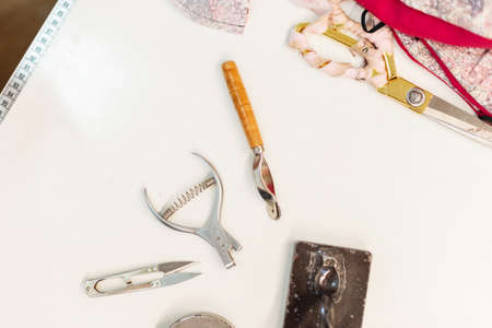 Set for creating and designing clothes. Creative workplace with scissors, centimeter, thread and...