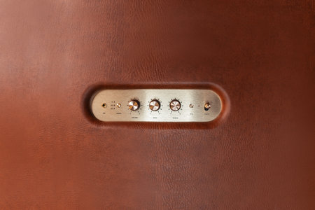 Gold vintage control panel with leather textured metal buttons. listening to music. Music player,...