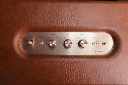 Vintage gold control buttons with red outline. Luxurious volume controls and audio stereo, close-upの写真素材