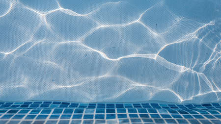 Swimming pool with blue water, top view. water textureの写真素材