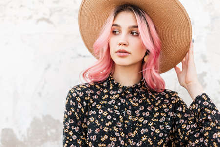 Fresh beauty portrait pretty stylish young woman in vintage straw hat in elegant beautiful floral...