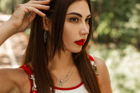 Attractive model woman with red lipstick and sexy lips with beautiful eyes in fashionable white top...
