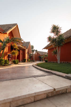 Beautiful resort bungalows house with palm trees and greenery on the island. summer holidaysのeditorial素材