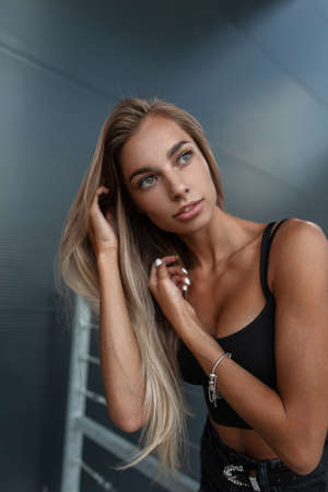 Beauty portrait of fashion sexual caucasian woman model with pretty face in black tank top with...