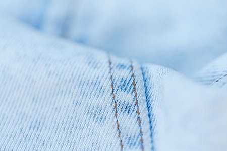 Light blue jeans texture, close-up. Jeans fashion and denim fabricの写真素材