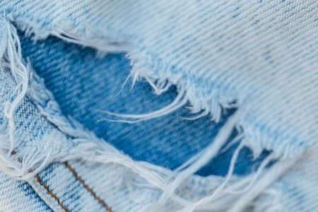 Ripped jeans, close-up. Fashion denim pantsの写真素材