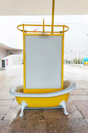 Billboard white ad free copy space for layout, yellow metal bath outside. water conceptの写真素材