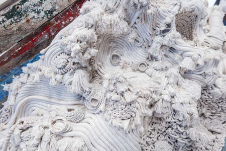 White rope of a sea boat. fabric texture. industry. Lots of ship's rope