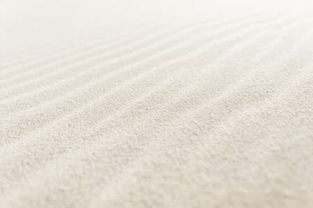 Beautiful sand texture on the beach. White sand beach by the oceanの写真素材