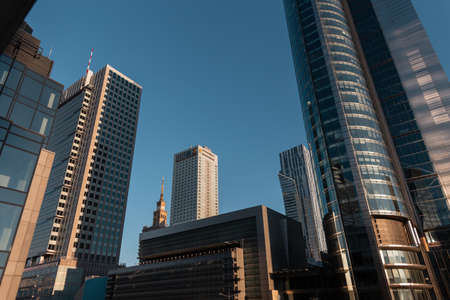 Poland, Warsaw. Downtown and sky city with modern glass business buildingsの写真素材