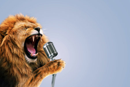Beautiful lion holds a vintage microphone and sings karaoke. Party music, concert. creative idea and king animalの写真素材