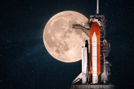 beautiful space shuttle prepares for launch against the backdrop of an amazing full moon in the starry sky. Space mission concept.の写真素材
