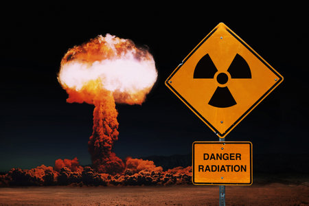 Yellow sign danger radiation against the background of a nuclear explosion. world nuclear war. Explosion, concept. global catastrophe. nuclear mushroomの写真素材