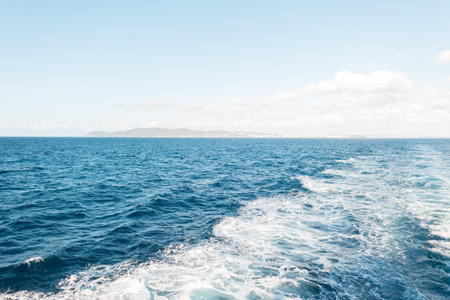Amazing blue sea with waves with the island of Elba, Italy. Journey to the islandの写真素材