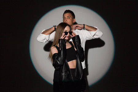 Stylish beautiful couple handsome man and beautiful girl wear cool sunglasses in fashion trendy...
