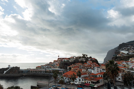 Amazing Madeira island with beautiful fishing CÃ¢mara de Lobos village with houses, pier, mountain...