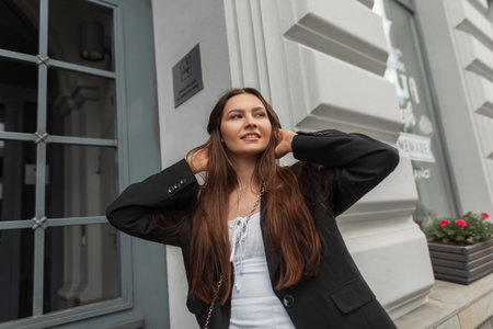 Happy young Pretty lady with smile in street casual outfit walks on the streetの写真素材