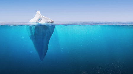 White Iceberg in clear blue water sea, under water view. Iceberg - Hidden Danger And Global Warming Concept. Floating ice in ocean. Tip of the iceberg Greenland. Copy space for text and design.の写真素材