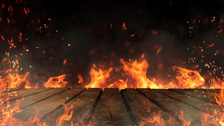 Wooden table and fire with sparks and smoke, concept. Grill, burning fire and free copy space for...
