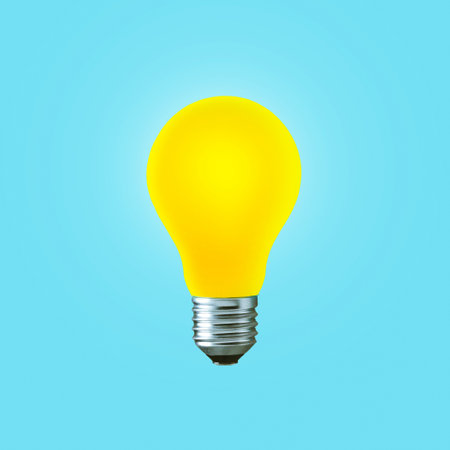 Creative yellow light bulb burns on a blue background, concept. Think differently, creative idea. Light came on. Thinking and start-up. Successful projectの写真素材