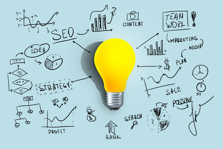 Creative yellow light bulb with strategy plan and descriptions on a blue background. Strategy and successful project, creative idea. Think differently. Start up. SEOの写真素材