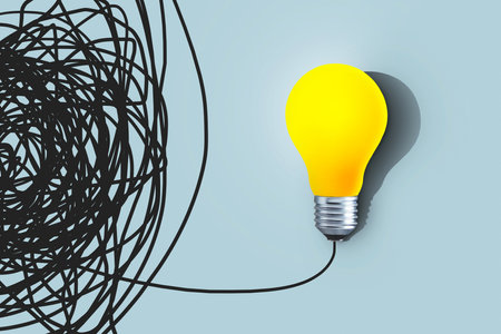 Tangled line leads to yellow light bulb, creative idea. Problem solution, concept. Think differently. Leader and successの写真素材