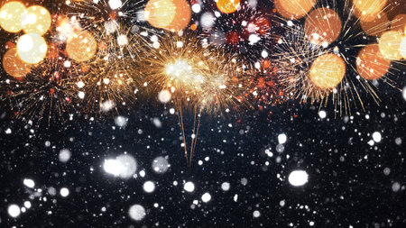 Amazing golden fireworks with snow on the starry sky with a yellow bokeh light. New Year 2024 and Christmas cardの写真素材