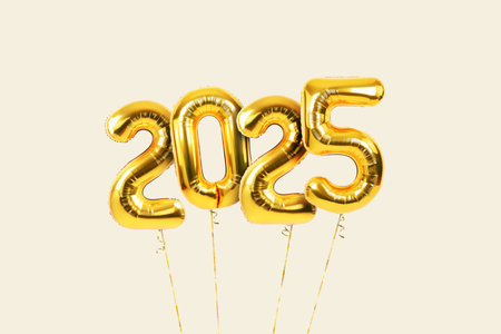 Festive golden New Year 2025 balls flying on beige background. Vintage numbers 2025.の写真素材