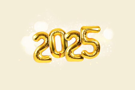 Golden festive balloons 2025 with sparkles and bokeh on beige background. Happy new year cardの写真素材