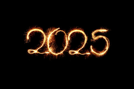 New Year 2025 sparkler golden light. Sparklers draw figures 2025. Bengal lights and letter. Holidays 2025 card.の写真素材