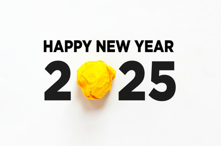 Happy New Year 2025 on white paper texture, creative idea. Yellow lamp paperの写真素材