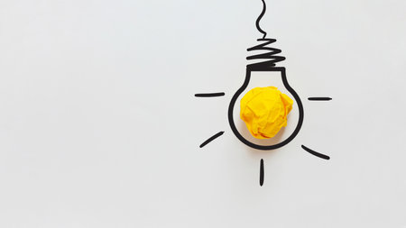 Yellow crumpled paper light bulb drawn on a white background. Brainstorm and creative idea, concept. Project and startup. Every thing begins with Ideaの写真素材