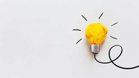 Yellow crumpled paper light bulb drawn on a white background. Brainstorm and creative idea, concept. Project and startup. Business and growthの写真素材