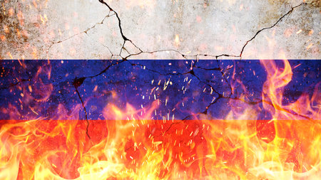 Russian flag on fire with flames and sparks on cracked concrete wall. Revolution, concept. Freedom and patriotism. Economic crisis, creative.の写真素材