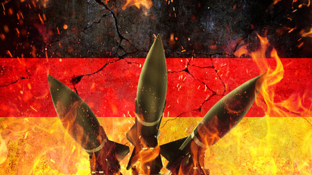 Rockets on fire against the backdrop of the Germany flag on a cracked concrete wall. War in Europe. Rockets weapons with fire on a black background, concept. War and death. World War 3. Nuclear War,の素材