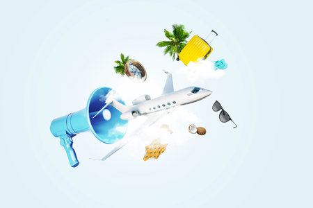 Creative blue loudspeaker with airplane, clouds, compass, luggage, bag, glasses, palm trees and swimsuit. Travel, creative idea. Advertising and attracting attention. Summer timeの写真素材