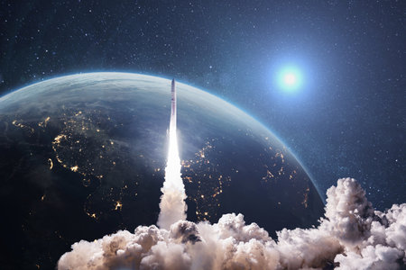 Rocket lift off. Space shuttle with smoke and blast takes off into space on a background of blue planet earth with amazing sunset. Successful start of a space mission. Travel to Marsの写真素材