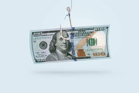 100 dollars on a hook, creative idea. Business and scam projects, concept. Scammersの写真素材