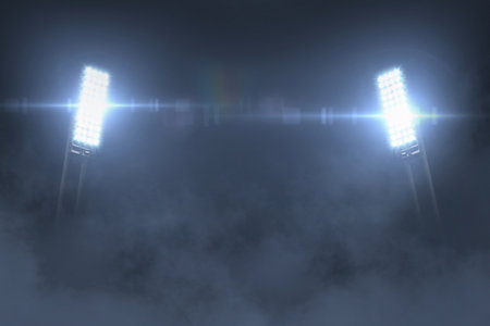 Beautiful bright glowing spotlights in the night with fog. Stadium and championship, creative idea. Free space for design and text, betting creativeの素材