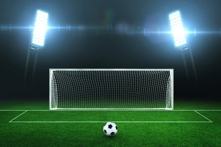 Night football field with green grass, with a goal, a ball and bright spotlights in the dark. Football championship and training. Penaltyの素材