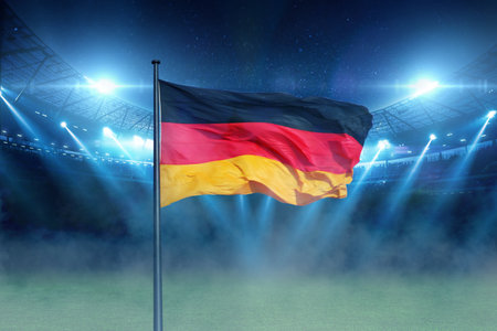 beautiful modern sports stadium with a green grass field with Germany flag shines with blue spotlights at night with stars. Sports tournament, European Football Championship 2024 in Germanyの素材