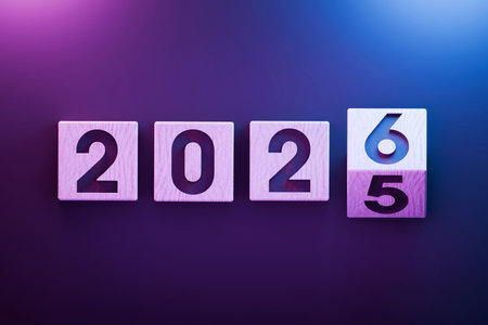Wooden blocks showing the transition from 2025 to 2026 with pink and blue light background, New Year, change, and fresh beginnings. 2026 top view, creative idea. 2025 turns into 2026, conceptの写真素材