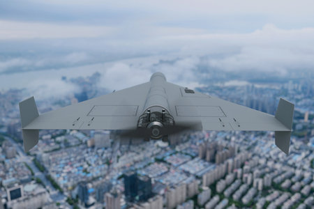 Military drone armed with explosives flies high above a city. Attack, concept. Modern warfare with drones and unmanned aerial vehicles.の写真素材