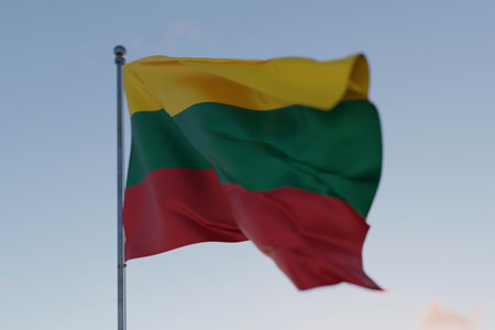 Lithuania national flag waving in the wind against a clear blue sky, symbolizing freedom, heritage, and pride. Patriotic concept. Travel, creative idea. Politics and Ethnicityの写真素材