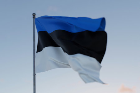 Estonia national flag waving in the wind against a clear blue sky, symbolizing freedom, heritage, and pride. Patriotic concept. Travel, creative idea. Politics and Ethnicityの写真素材