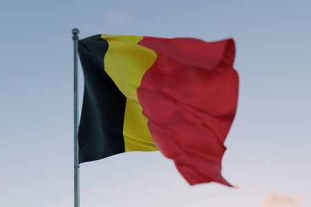 National flag of Belgium waving in the wind against a clear sky, symbolizing patriotism, independence, national pride, and unity. Freedom, creative. Travel, conceptの写真素材