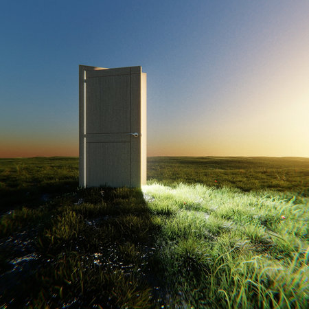 Open wooden door glowing with bright light in the middle of a green field under a evening sky. Concept of hope, new opportunities, freedom, and a fresh beginning. Creative ideaの写真素材